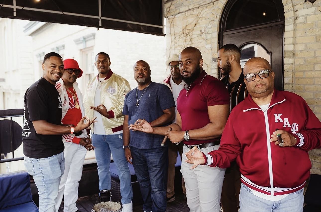 Brothers gathered together on a rooftop patio