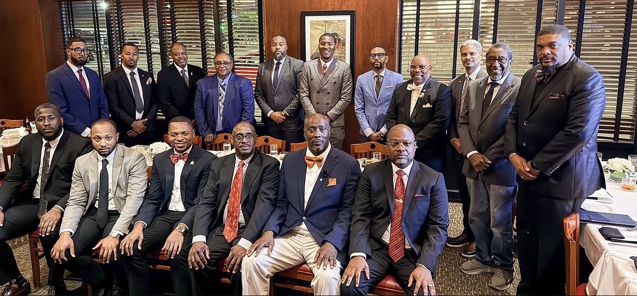 Chapter brothers in suits at a luncheon