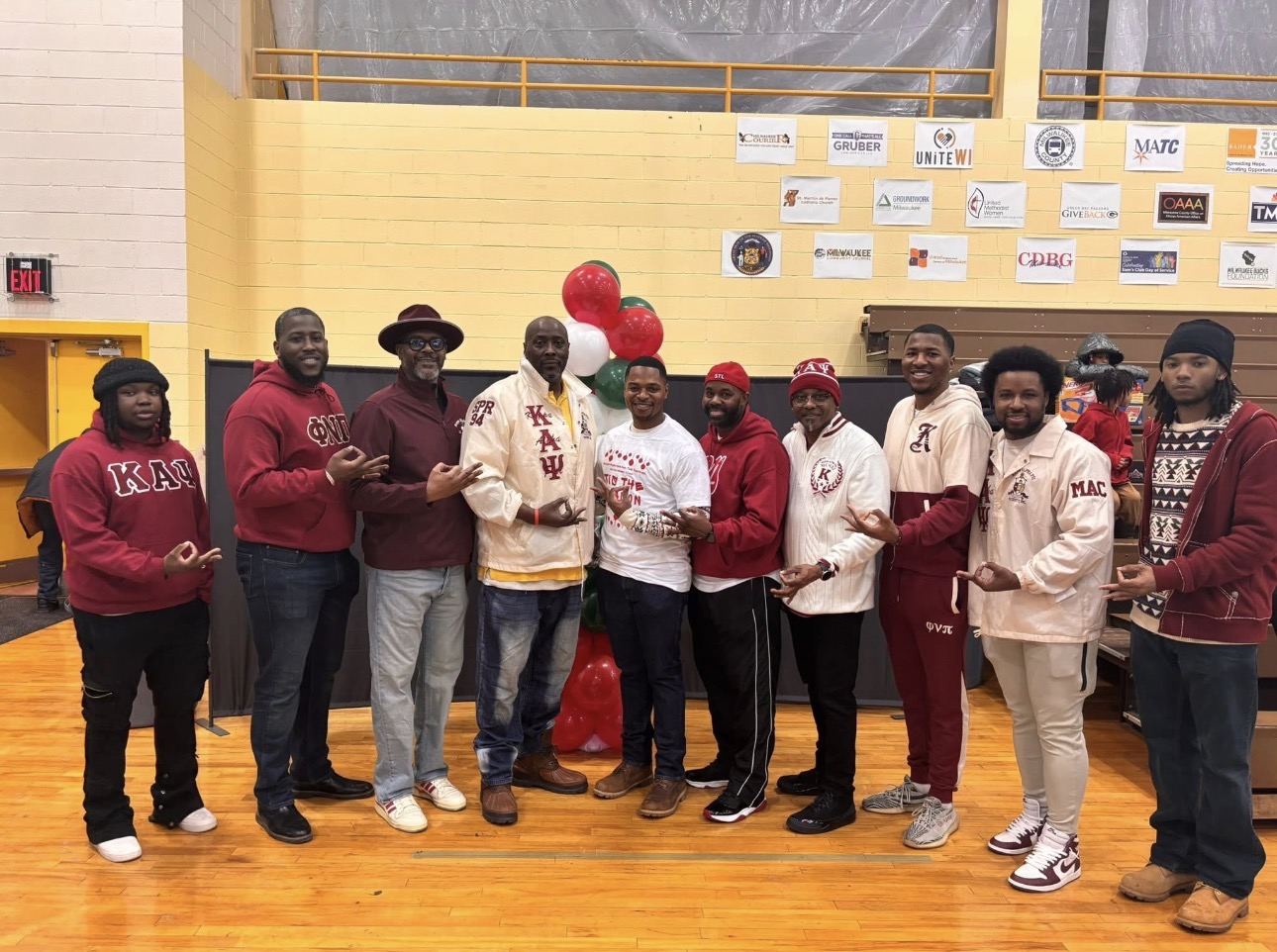 Brothers gathered at a community service event in a Milwaukee gym