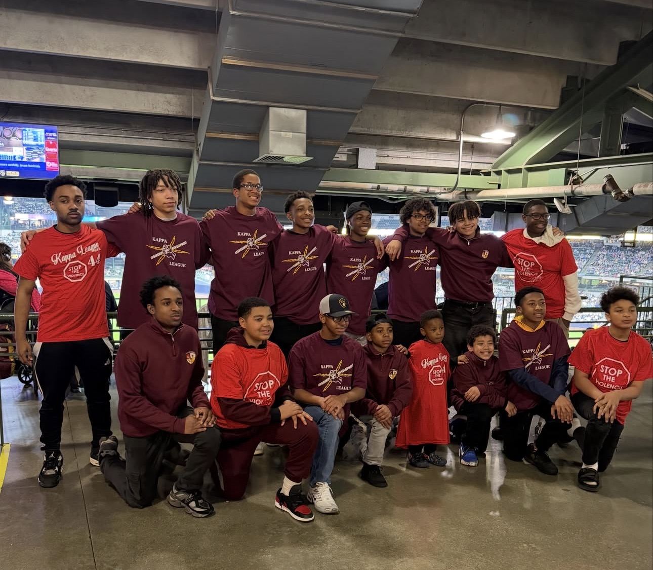 Kappa League young men together at a Milwaukee Brewers game, some in Stop the Violence shirts