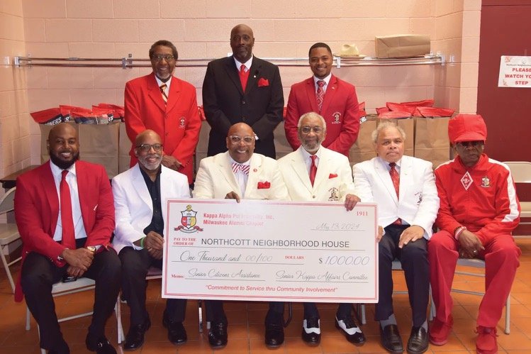 Senior Kappas presenting a $1,000 check from the Senior Kappa Affairs Committee to Northcott Neighborhood House for senior citizen assistance